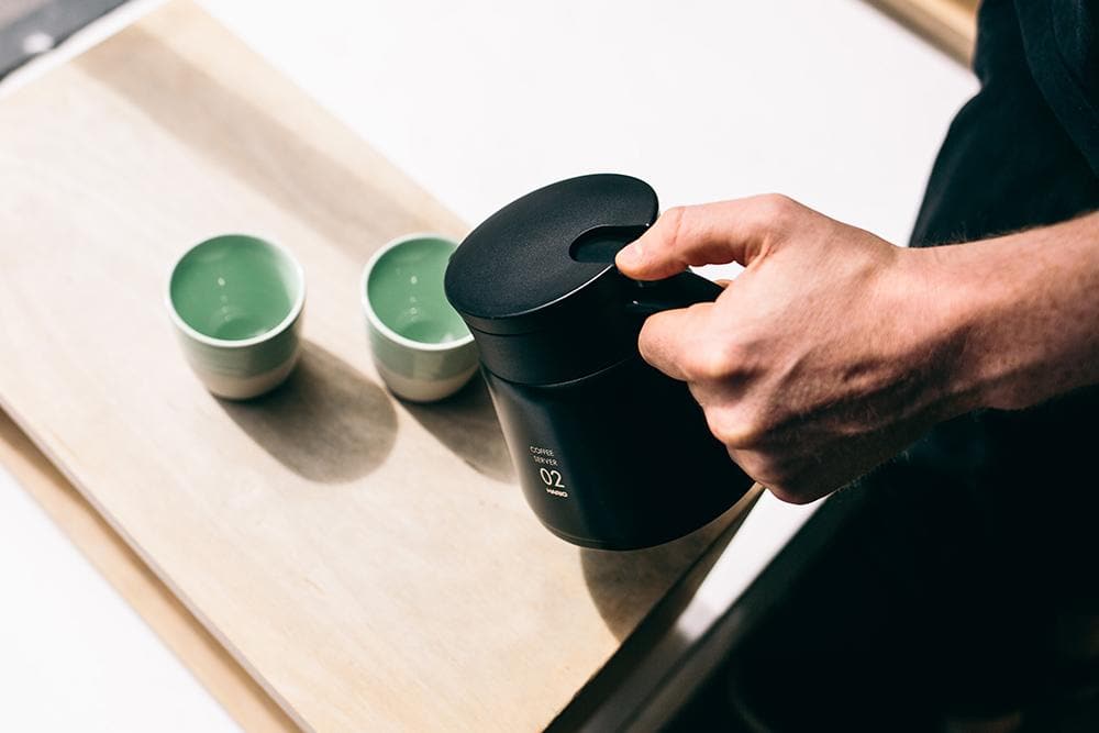 Man holding a coffee server